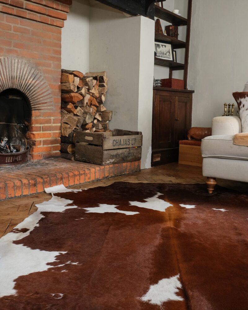 Brown and White Cowhide Rugs - Image 9