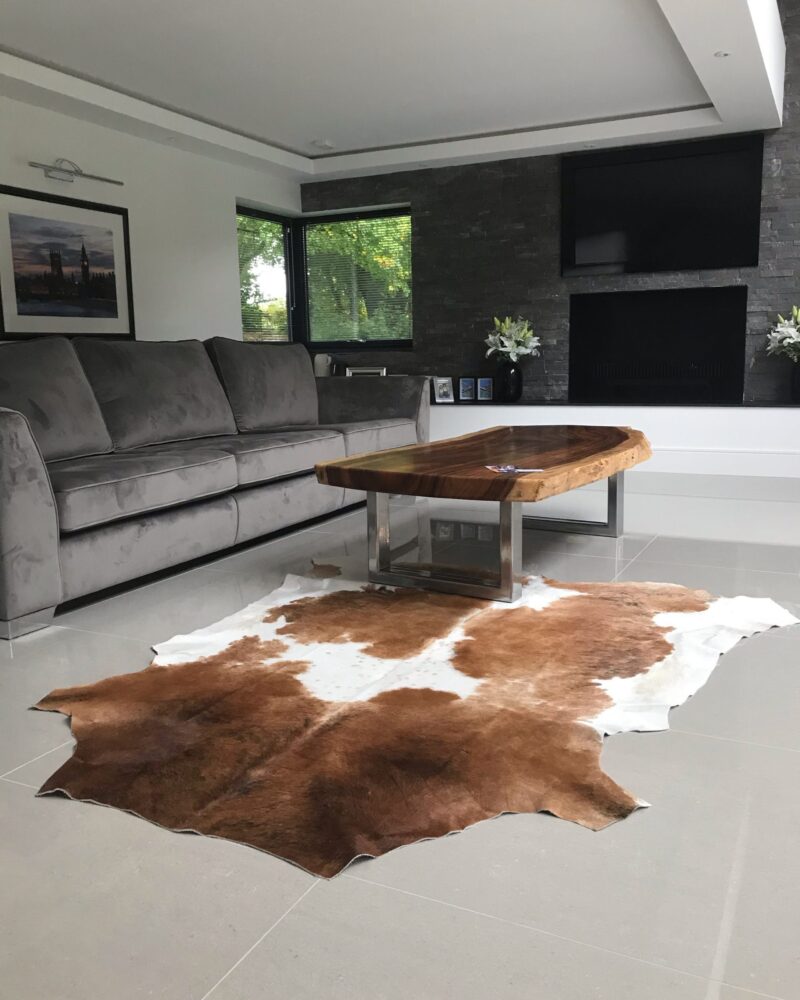 Brown and White Cowhide Rugs - Image 7